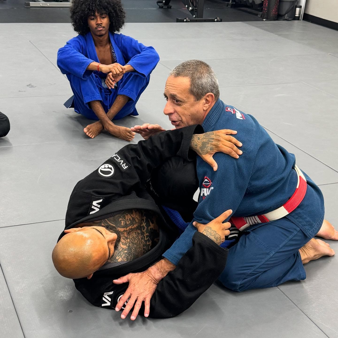Master Carlos Rollyson teaching a Brazilian Jiu Jitsu technique in an adult class in Hollywood, FL