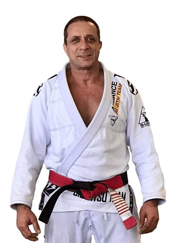 Master Carlos Rollyson in his gi and red-and-white coral belt