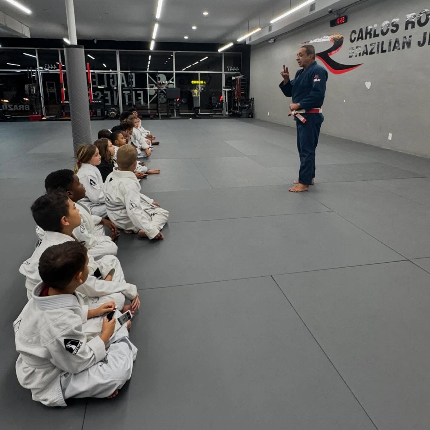 Master Carlos Rollyson leading a kids Jiu Jitsu class at the Hollywood academy